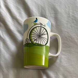 Starbucks Green and White Ceramic Mug with Bicycle Design
